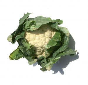 White vegetable wrapped in green leaves